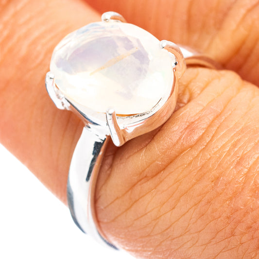 Oval opal ring in .925 sterling silver, prong-set with pale iridescent stone
