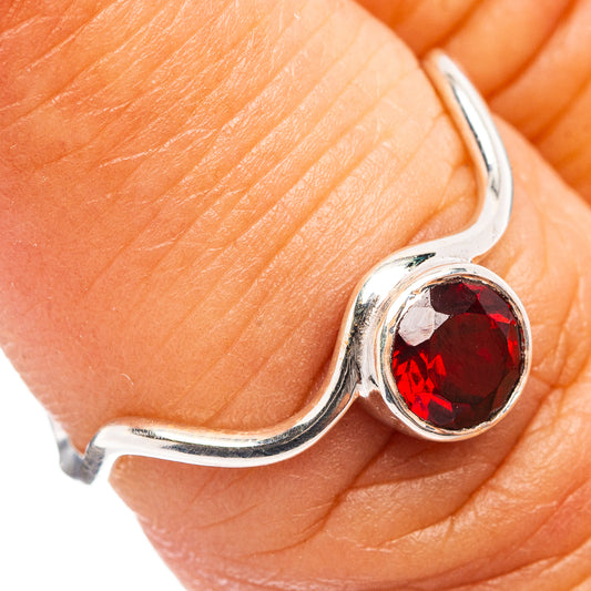 Sterling silver garnet ring with oval red gemstone bezel, slim open band