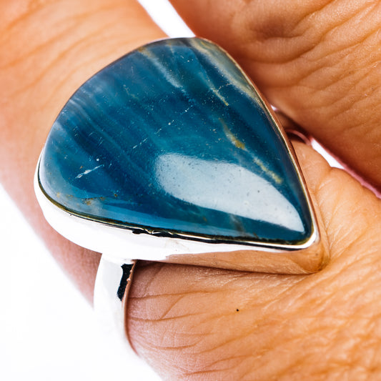 Sterling silver ring with blue teardrop cabochon gemstone and raised bezel