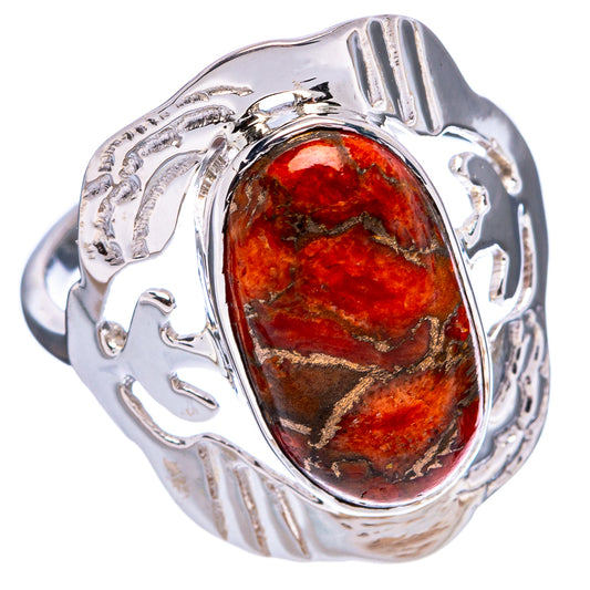 Sterling silver ring featuring oval copper sponge coral stone in polished bezel setting