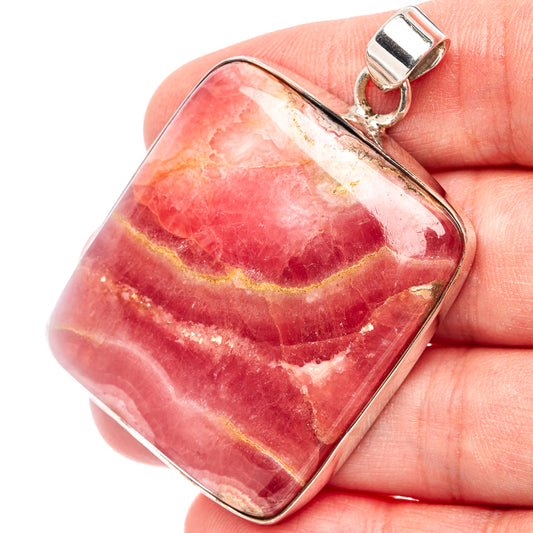Rhodochrosite pendant, .925 sterling silver frame; rectangular red-pink stone