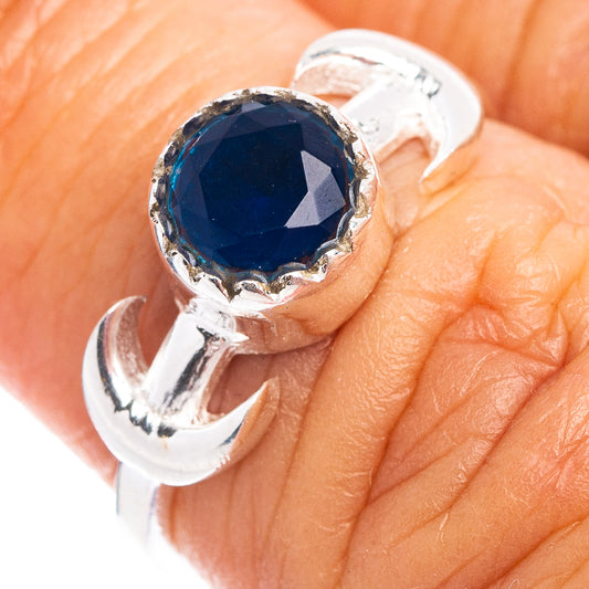 Dainty sterling silver ring with faceted dark-blue gemstone bezel setting