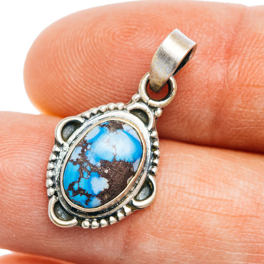 Oval turquoise pendant in ornate .925 sterling silver bezel setting