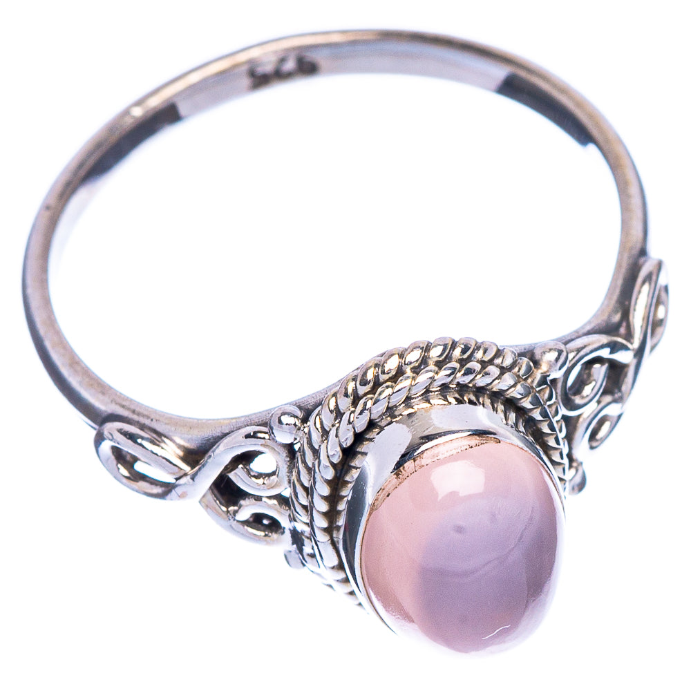 Sterling silver ring featuring oval rose quartz cabochon and braided bezel setting