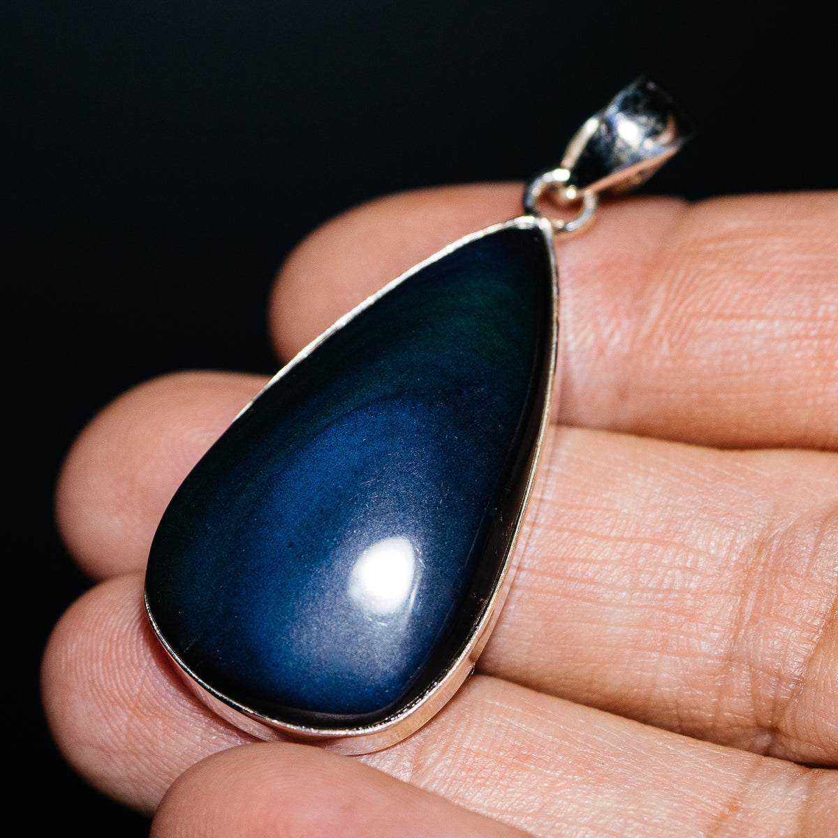 Teardrop rainbow obsidian pendant in a sterling silver setting