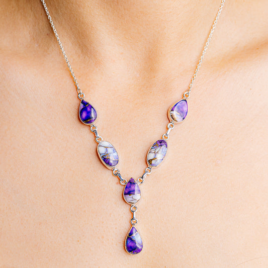 Sterling silver necklace with purple teardrop gemstones and blue veined accents