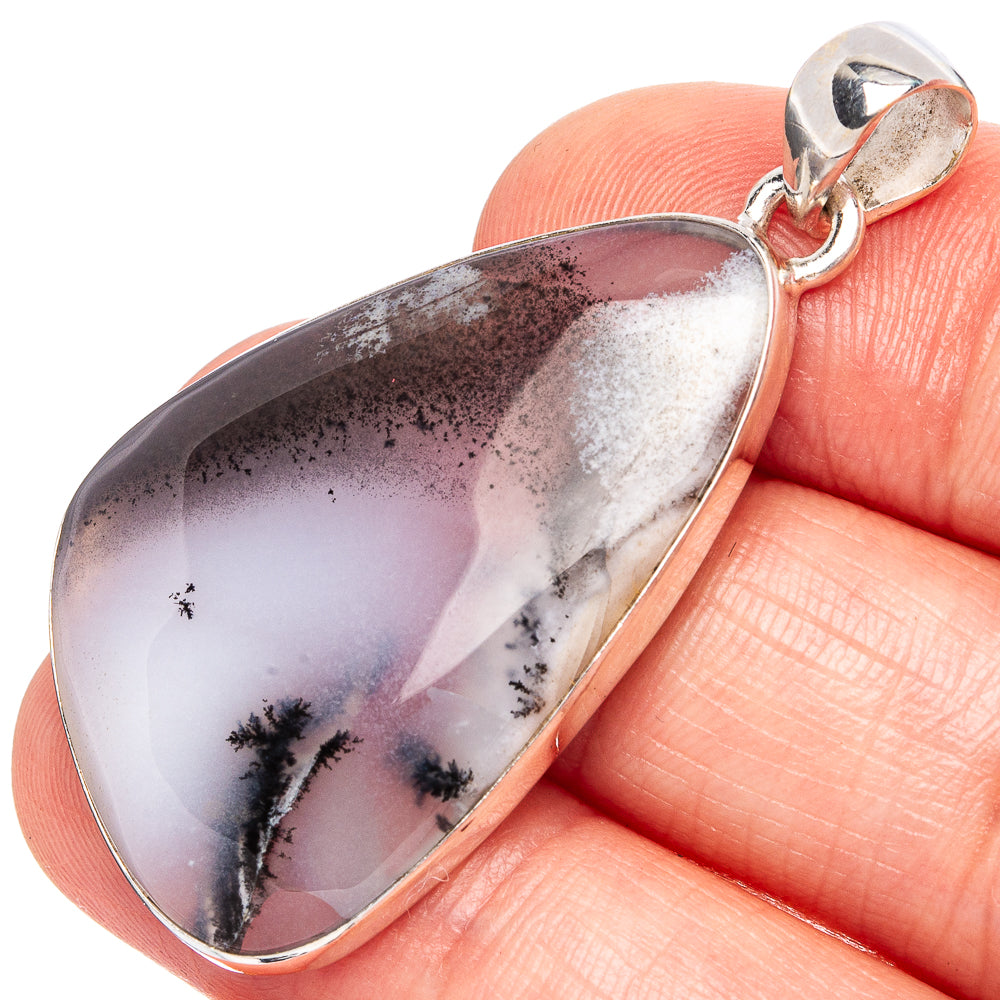 Sterling silver opal pendant with teardrop bezel and dendritic white-gray stone design