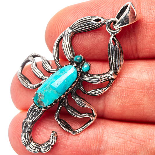 Turquoise scorpion pendant in .925 sterling silver with oval blue stone and tiny accents