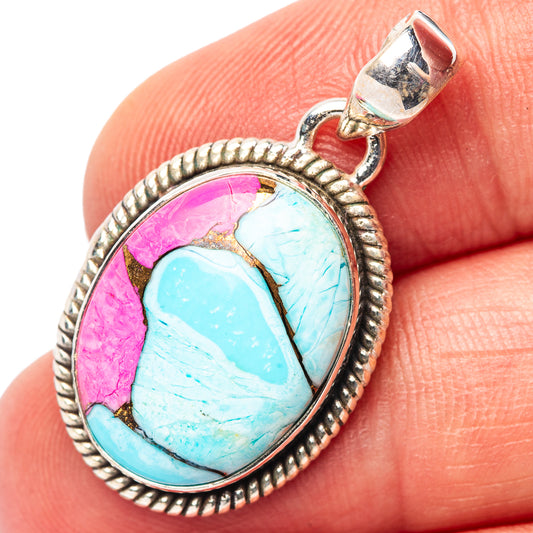 Sterling silver oval pendant with blue turquoise stone and pink matrix detail