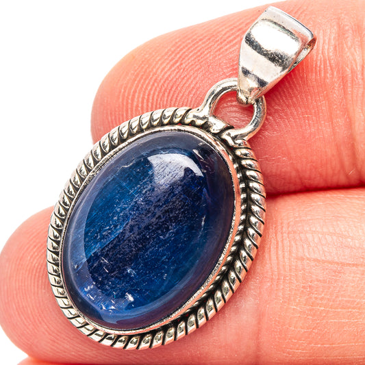 Oval kyanite pendant in .925 sterling silver with textured bezel and loop bail