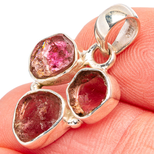Sterling silver tourmaline pendant with three faceted pink stones, side view