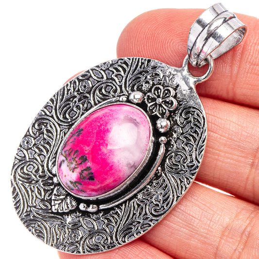 German silver filigree pendant with pink oval dendritic opal and loop bail