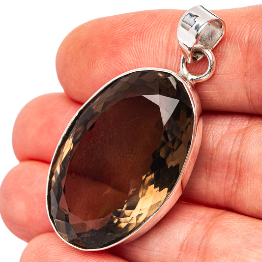 Oval smoky quartz pendant with .925 sterling silver bezel and loop bail, dark facets