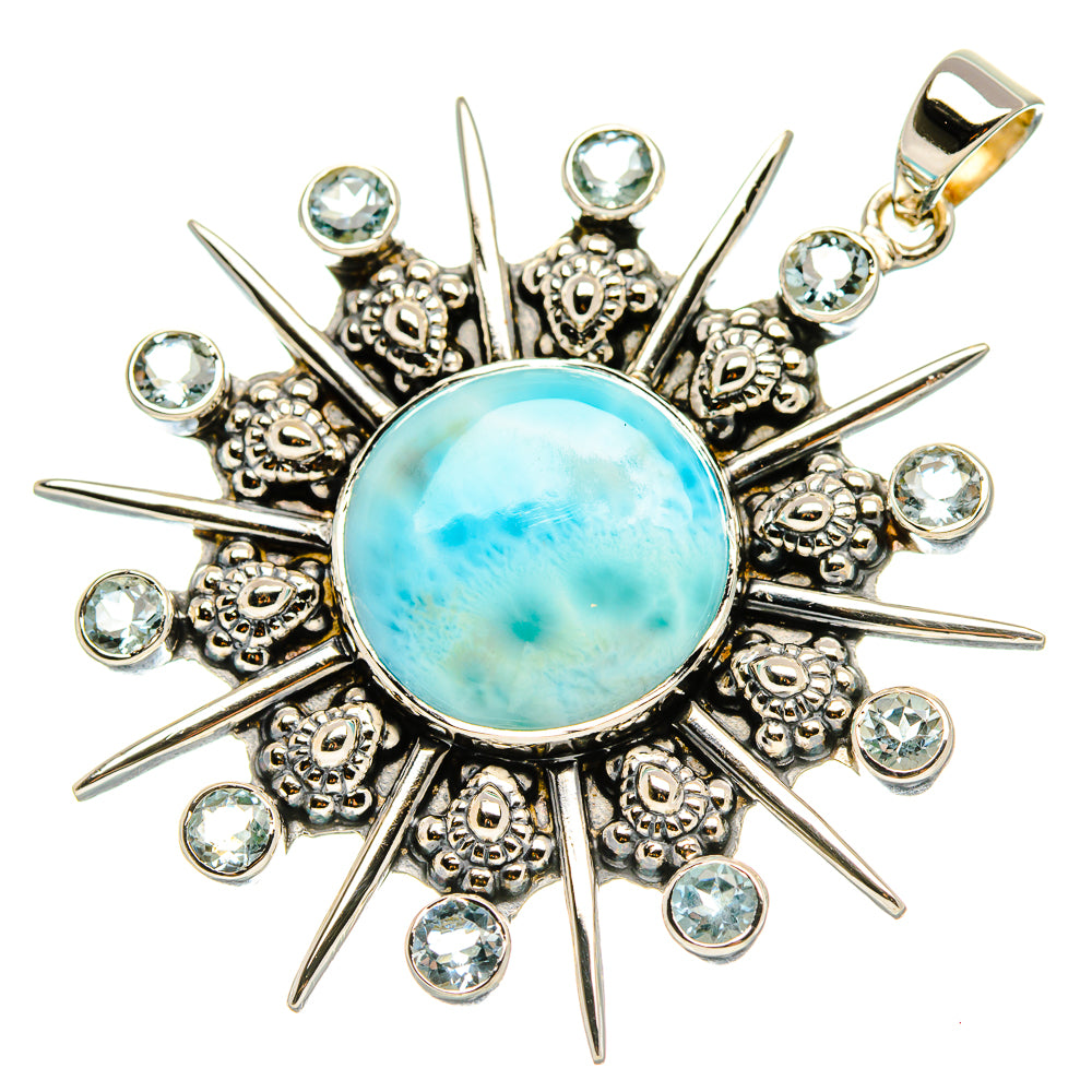 Sterling silver sunburst pendant with round blue cabochon, clear stone accents, top bail