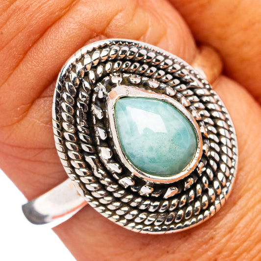 Silver oval gemstone ring with mint-green larimar center and engraved rope-style setting