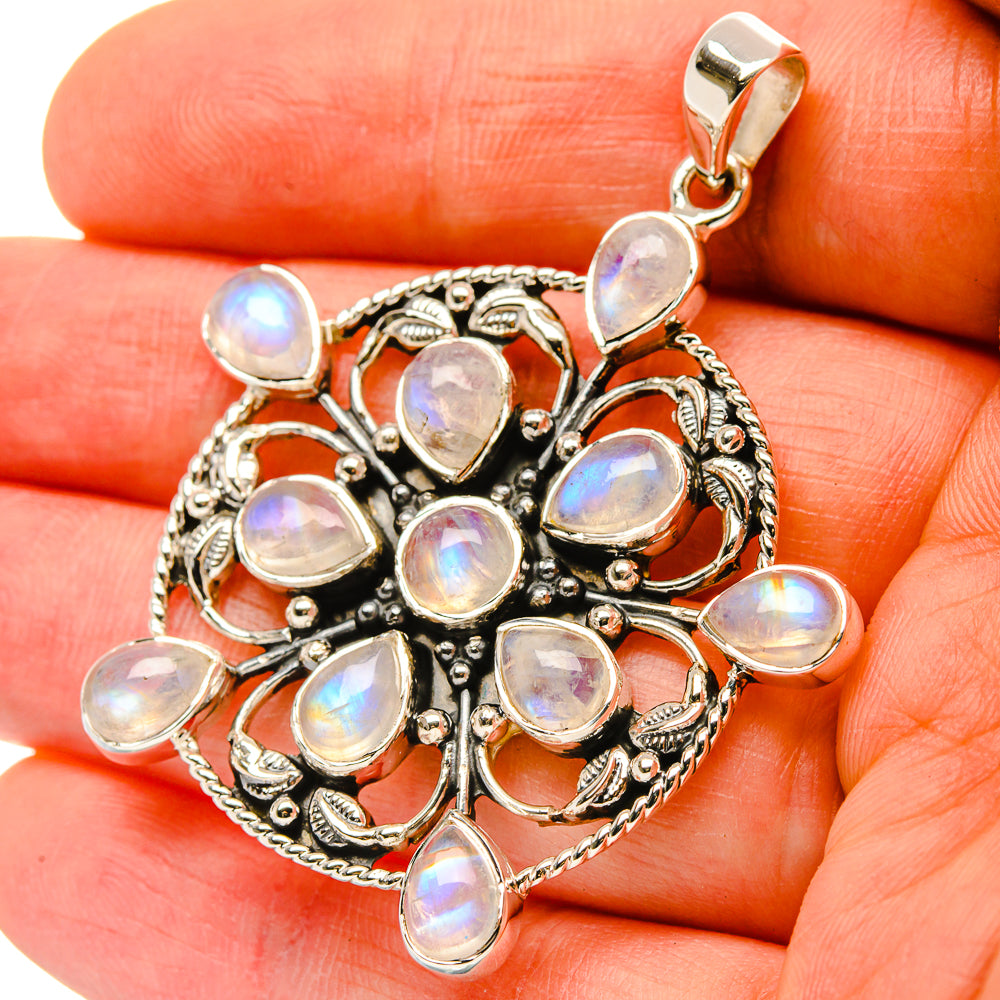 Rainbow moonstone pendant in 925 silver, round bezel stones with ornate filigree
