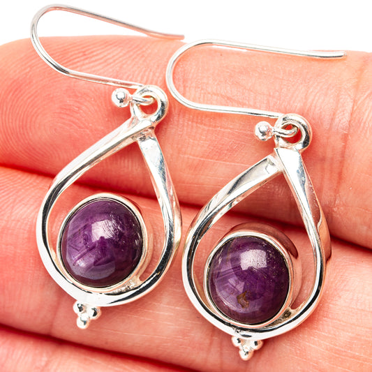 Sterling silver drop earrings with purple star ruby teardrop cabochons and hooks