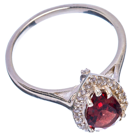 Sterling silver ring with garnet center stone and cubic zirconia accents