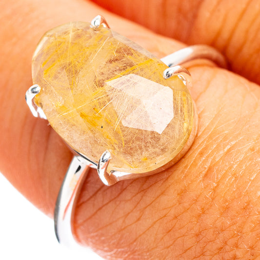 Sterling silver ring with oval faceted rutilated quartz stone, gold needles in clear quartz