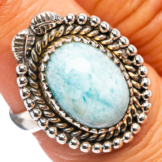 Larimar cabochon ring in .925 sterling silver with oval blue stone and bead-edge setting