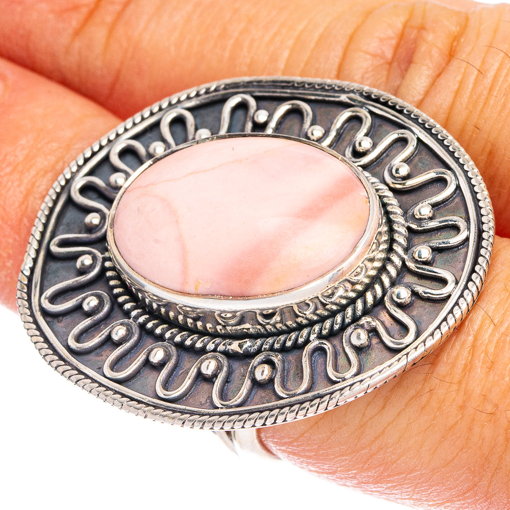 Oval pink opal sterling silver ring with ornate halo filigree setting