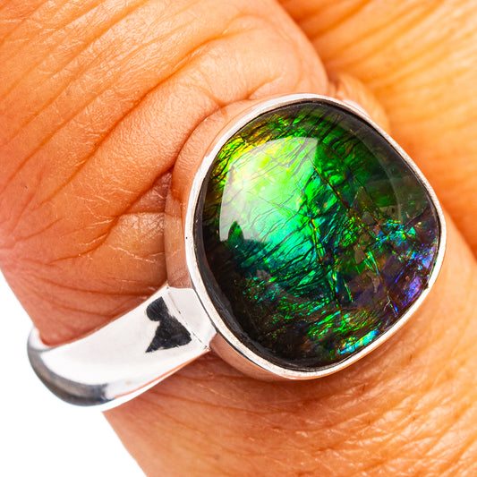 Oval ammolite stone ring in sterling silver, iridescent green-blue-purple on finger