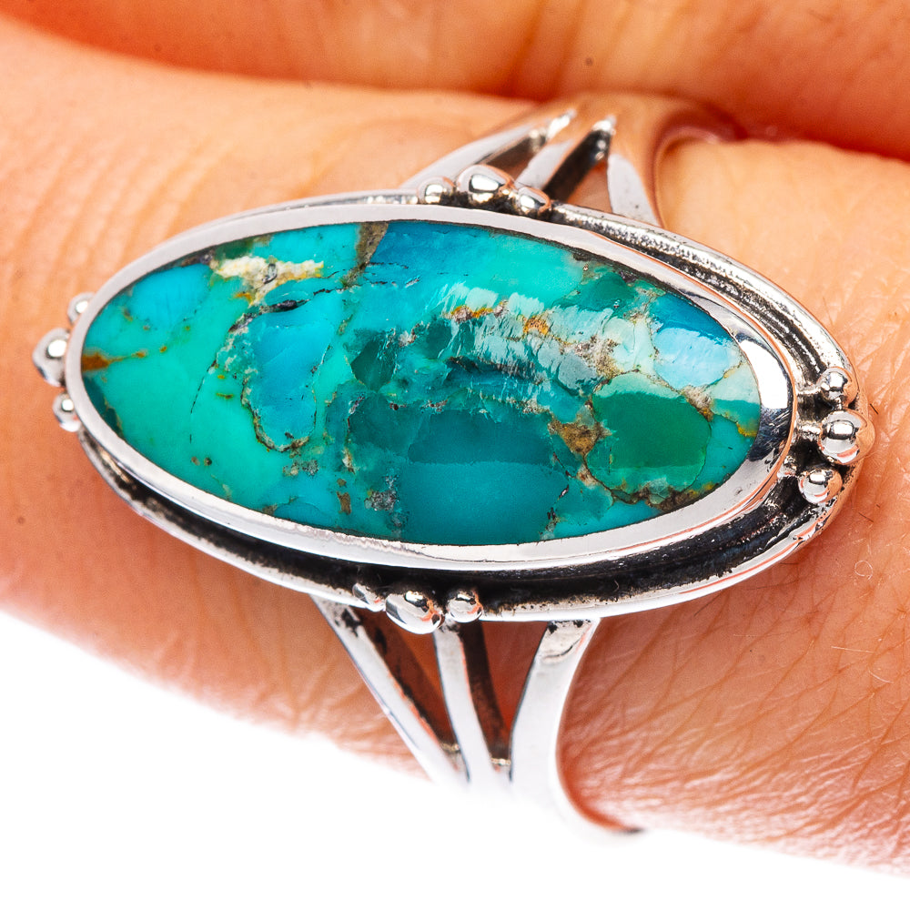 Sterling silver Arizona turquoise oval ring with raised bezel and decorative side prongs