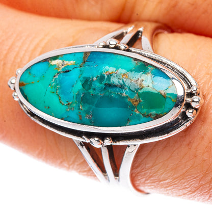 Sterling silver Arizona turquoise oval ring with raised bezel and decorative side prongs