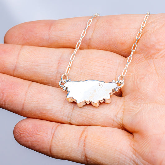 Turquoise pendant necklace with .925 sterling silver chain and pale oval centerpiece