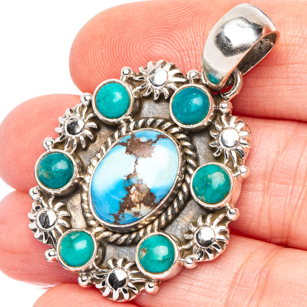 Turquoise pendant in .925 sterling silver with oval blue center and round teal stones