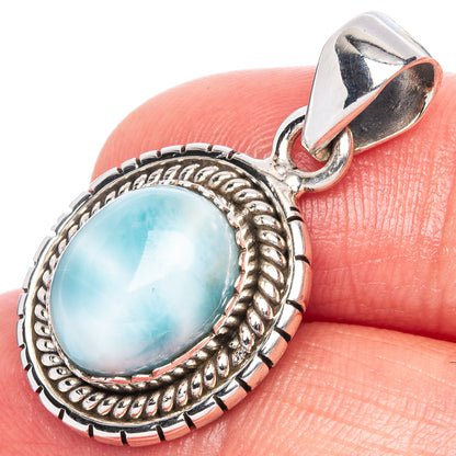 Oval Larimar pendant in 925 sterling silver, ornate rope bezel and loop bail.