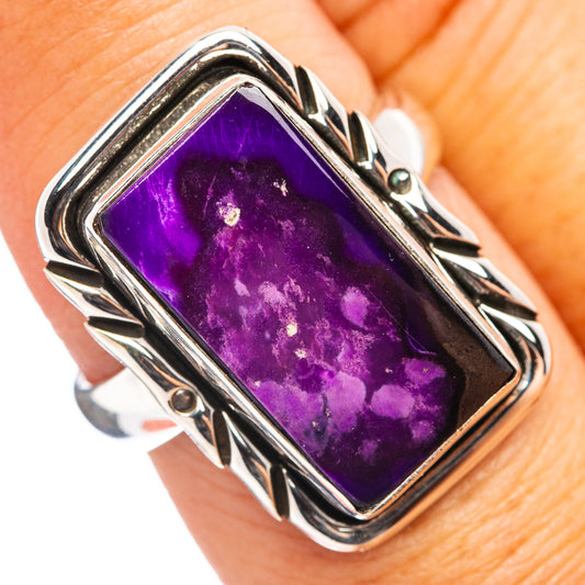 Sterling silver ring with rectangular purple sugilite gemstone, ornate metal frame