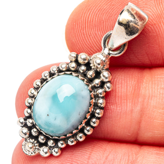 Larimar pendant with oval blue cabochon and beaded .925 sterling silver border