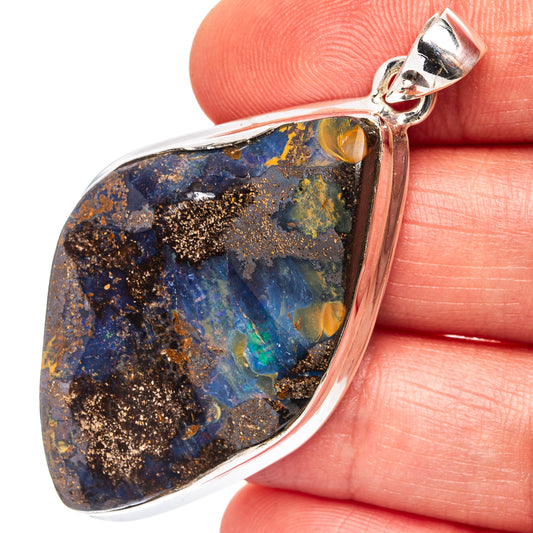 Sterling silver boulder opal teardrop pendant with blue, gold and orange gemstone center