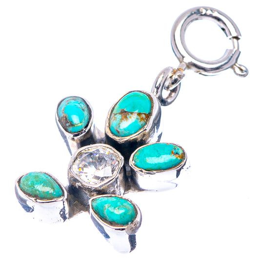 Sterling silver turtle pendant with turquoise cabochons, clear accent, and top loop