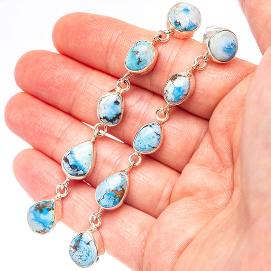 Sterling silver drop earrings with turquoise oval cabochons and linked dangle drops