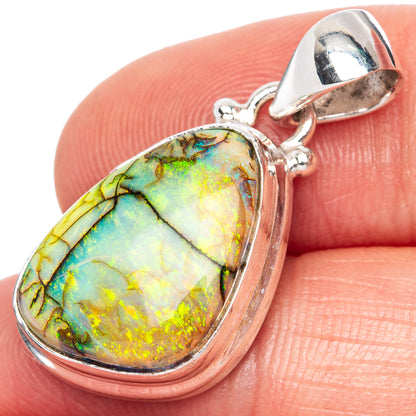 Oval opal pendant in sterling silver with rainbow green, blue, and gold shimmer