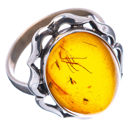 Sterling silver oval amber insect ring with golden-yellow stone, size 7.75