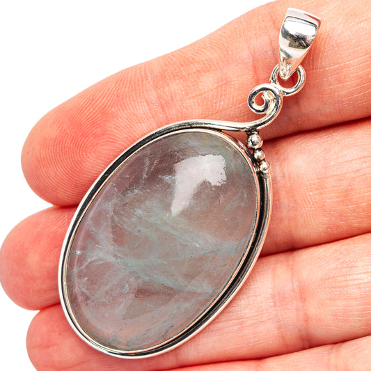Sterling silver pendant with oval aquamarine cabochon and loop bail