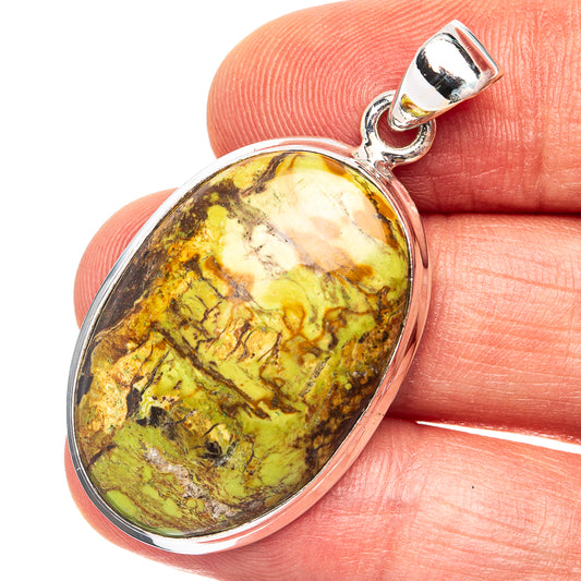 Oval gaspeite pendant, .925 sterling silver bezel with yellow-green cabochon