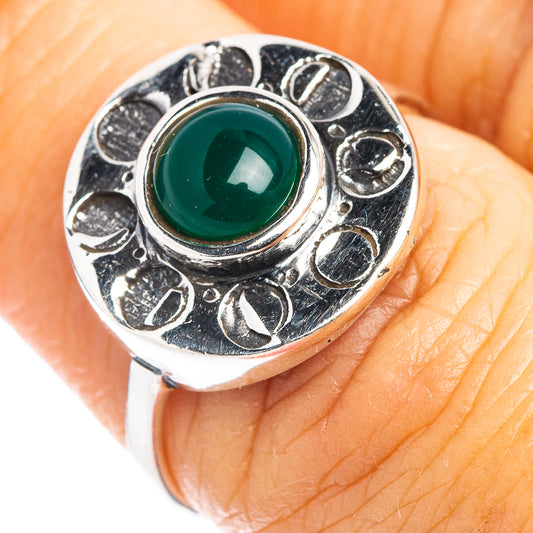 Sterling silver dainty ring with oval green onyx center stone, ornate bezel