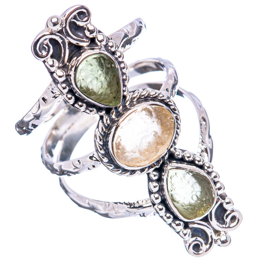 Sterling silver ring with three oval bezel-set stones, ornate scrollwork