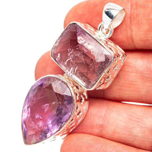 Amethyst pendant with faceted purple gemstones in .925 sterling silver teardrop setting
