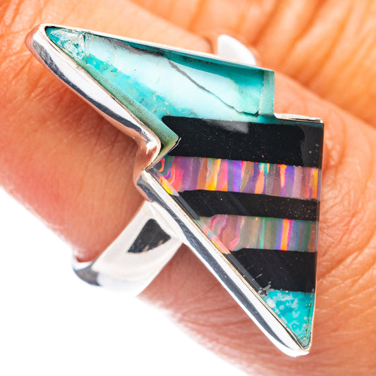 Sterling silver opal bolt ring close-up with turquoise, black, iridescent stripes