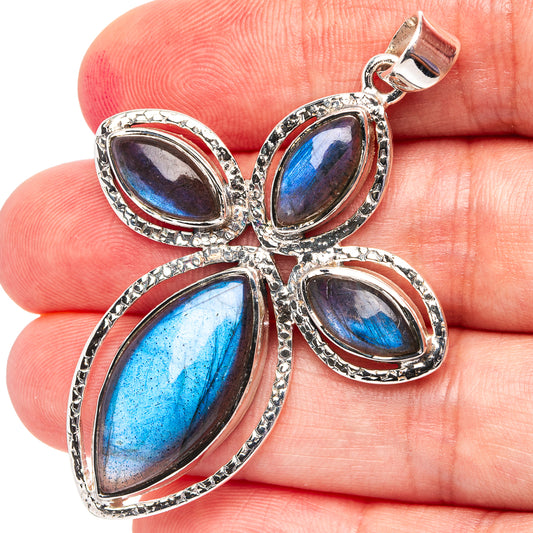 Sterling silver labradorite pendant with four oval stones in a cross setting, bail top