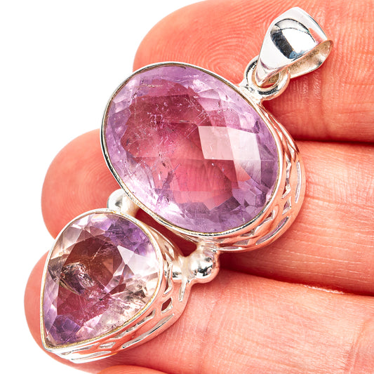 Sterling silver amethyst pendant with oval faceted purple gemstone and bail