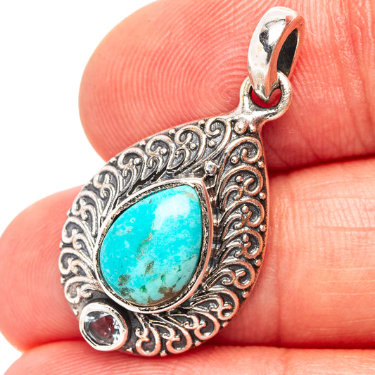 Sterling silver turquoise teardrop pendant with scrollwork and three small gemstone accents