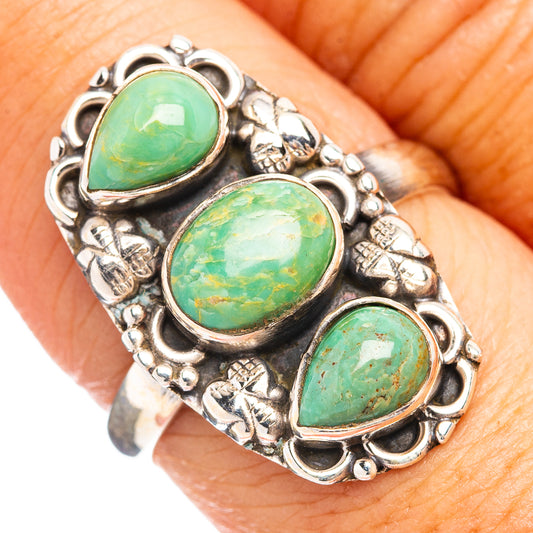 Sterling silver ring with three oval turquoise cabochons in ornate bezel settings