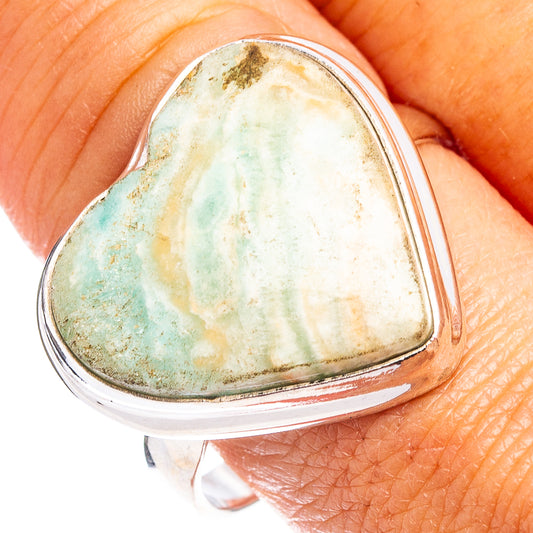 Sterling silver heart ring with blue-green aragonite stone, close-up view