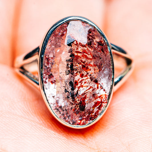 Oval sterling silver ring with faceted red-and-white lepidocrocite stone in bezel